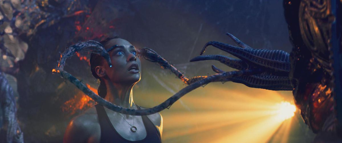 Skylines:  An alien tentacles grab a woman’s forehead