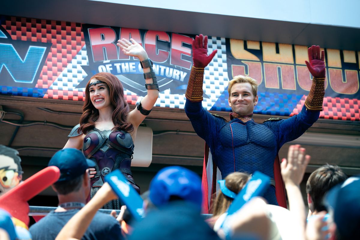Queen Maeve (Dominique mcelligott) and Homelander Anthony Starr) rally a crowd at the race of the century in The Boys