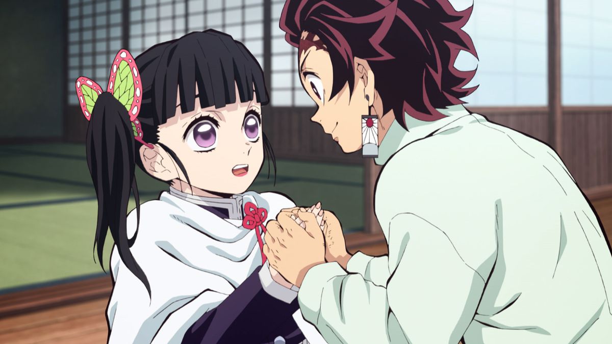 Tanjiro sweetly holding the hands of his friend. 