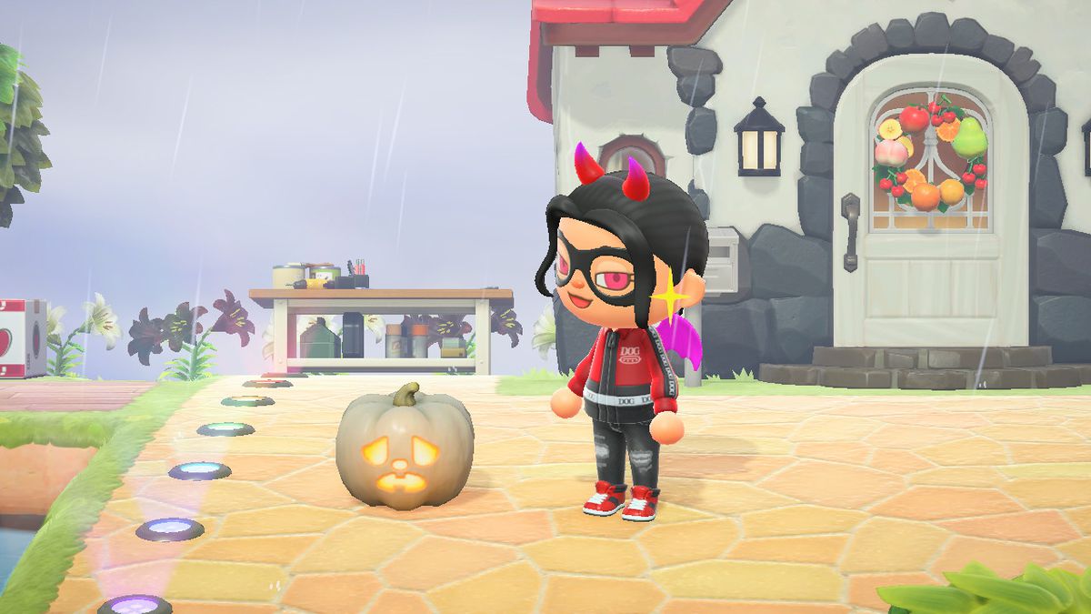 An Animal Crossing character with horns and wings smirks near a scared jack-o-lantern