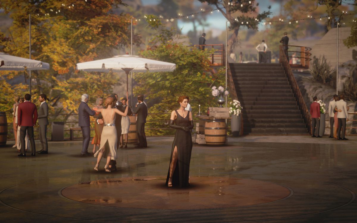 Diana Burnwood in a black evening gown, standing at the center of the dance floor waiting for Agent 47 in Hitman 3’s Mendoza level