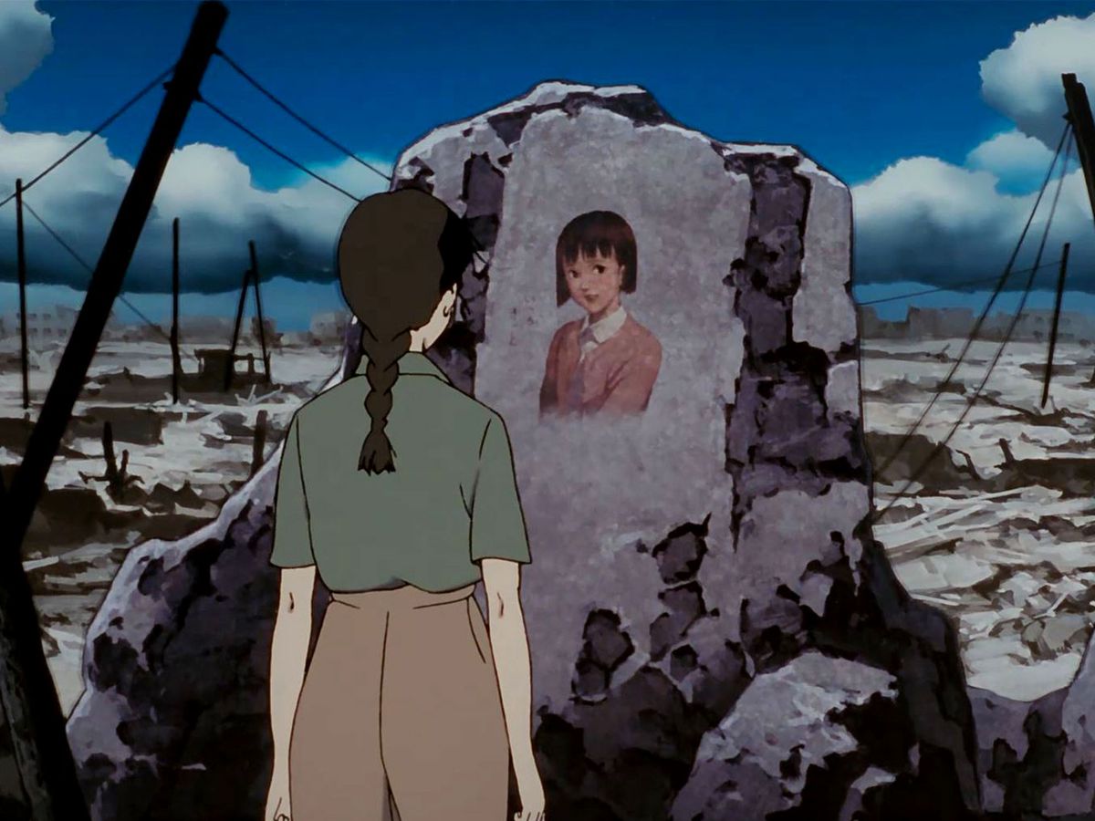 Chiyoko stares at a portrait of her younger self among the ruins of a devastated city
