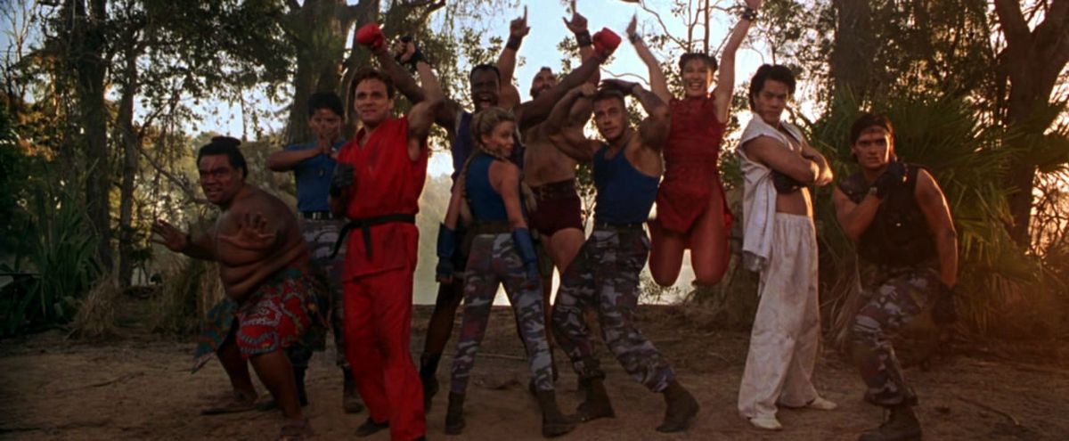 Ensemble freeze frame shot of the cast of Street Fighter including Jean-Claude Van Damme, Ming-Na Wen, Kylie Minogue, and Byron Mann