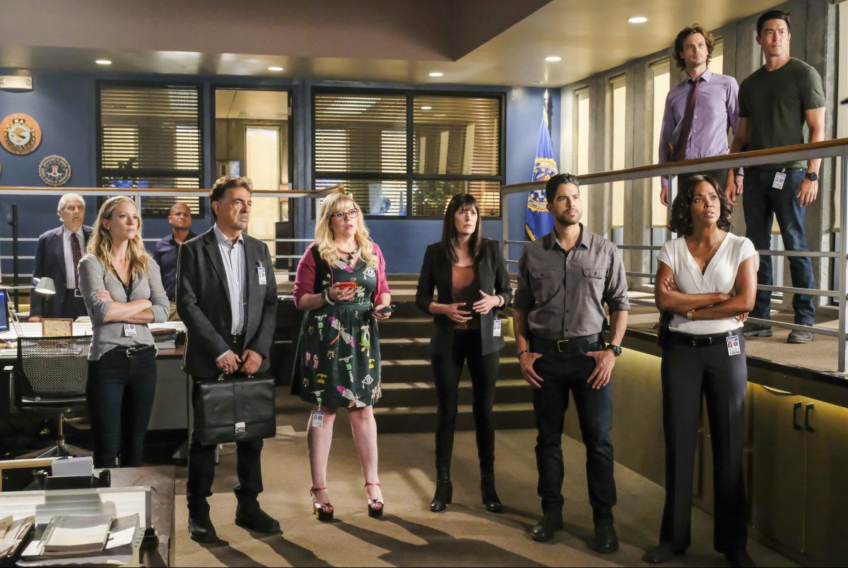 The cast of Criminal Minds stare pensively at something off-screen