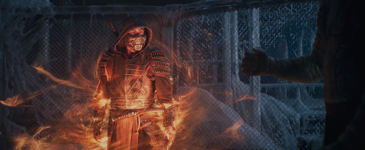 Scorpion stands in flames in an icy retreat in Mortal Kombat 2021