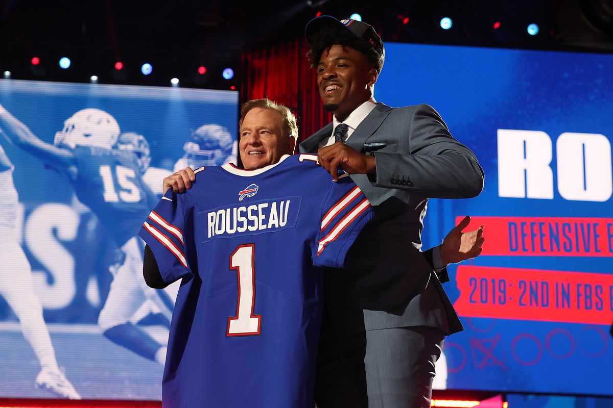 2021 NFL Draft: Gregory Rousseau stands with NFL Commissioner Roger Goodell onstage