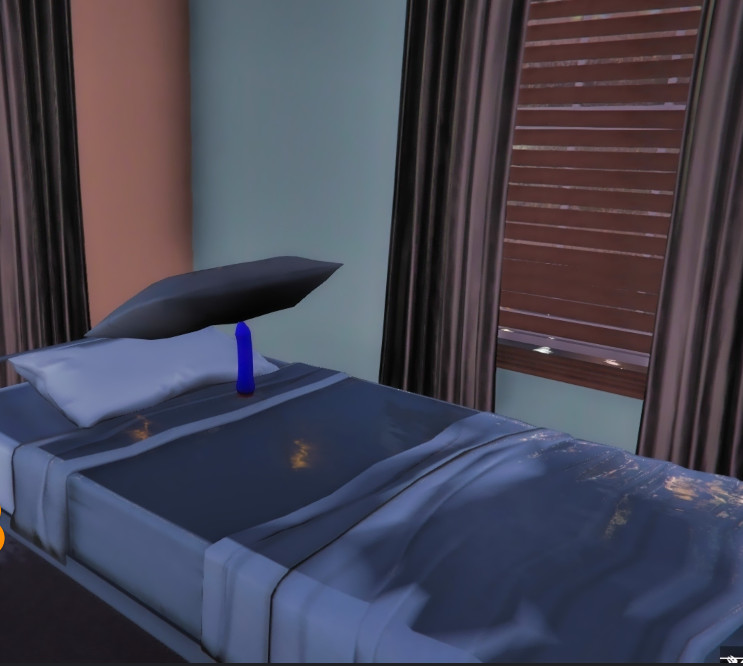 L'immagine di un vibratore su un letto di videogiochi.  Un cuscino è bilanciato sopra il vibratore.