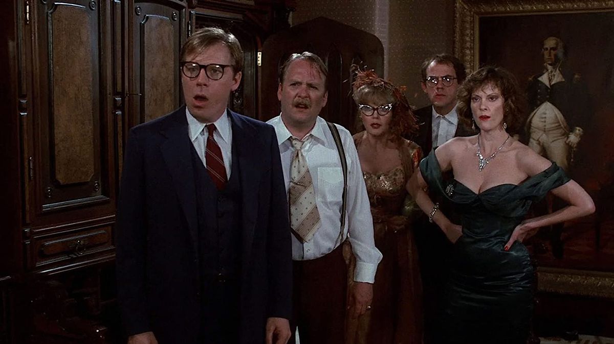 Five cast members in Clue gawp at the camera in response to the latest murder