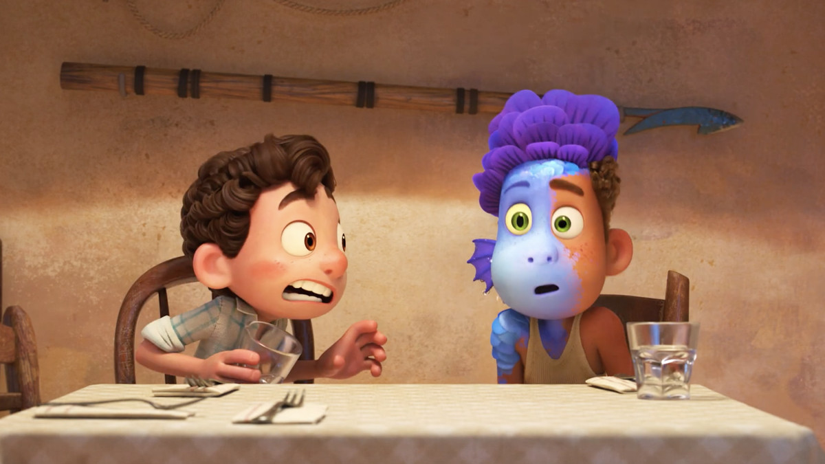 A boy spits on his friend and turns him into a sea monster at the dinner table in Luca