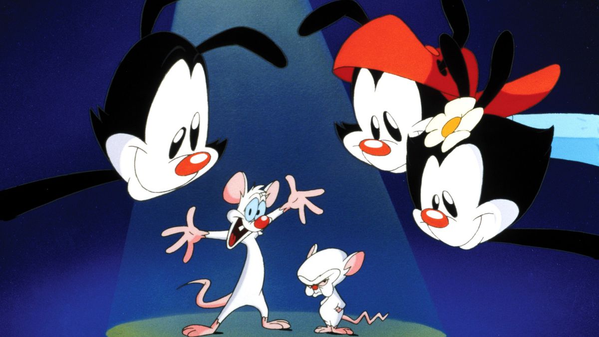 Un'immagine da un'apertura di Animaniacs, con Yakko, Wakko e Dot chini su Pinky e il cervello davanti a uno sfondo astratto