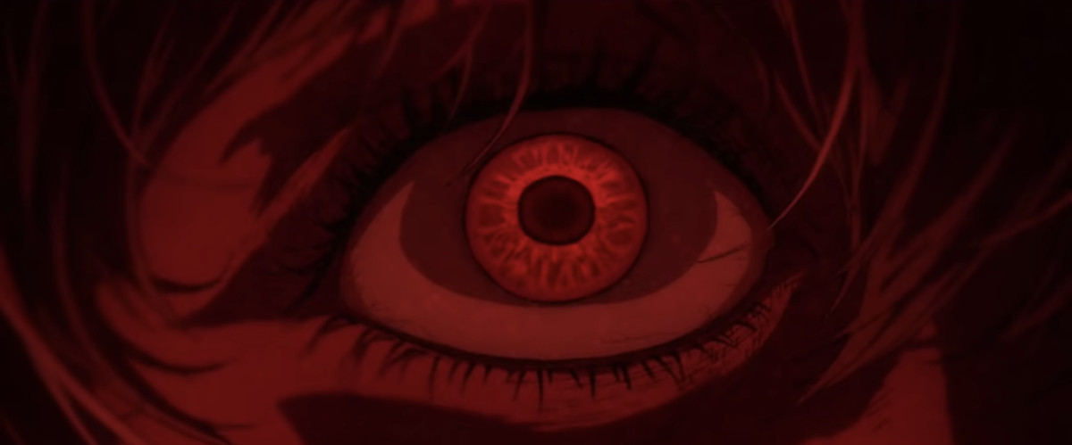 Un ampio bulbo oculare rosso in primo piano in Evangelion 1.0+3.0: Tre volte una volta