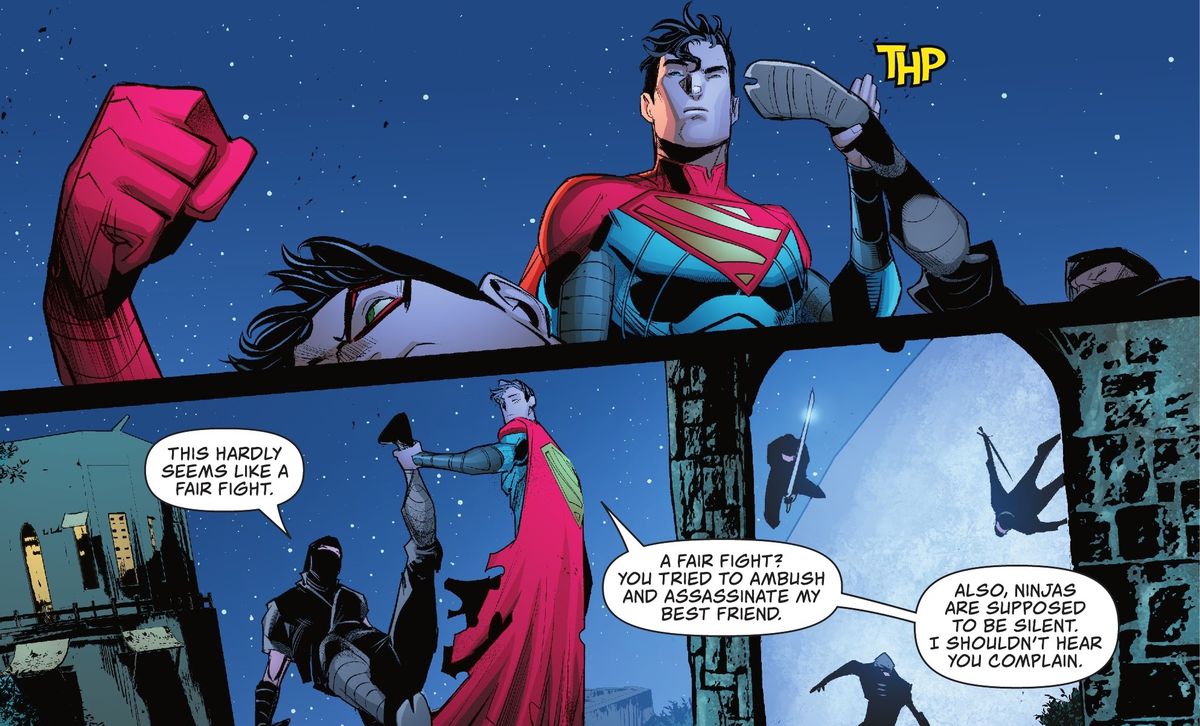 Jon Kent/Superman prende facilmente il calcio del ninja che lo sta attaccando e lo tiene a mezz'aria per la caviglia.  