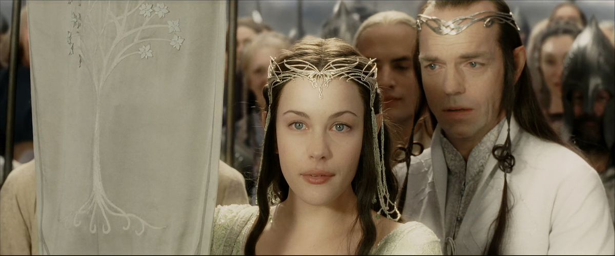 From behind his daughter, Hugo Weaving’s Elrond looks at her with an absolutely devastated expression on his face in The Return of the King. 