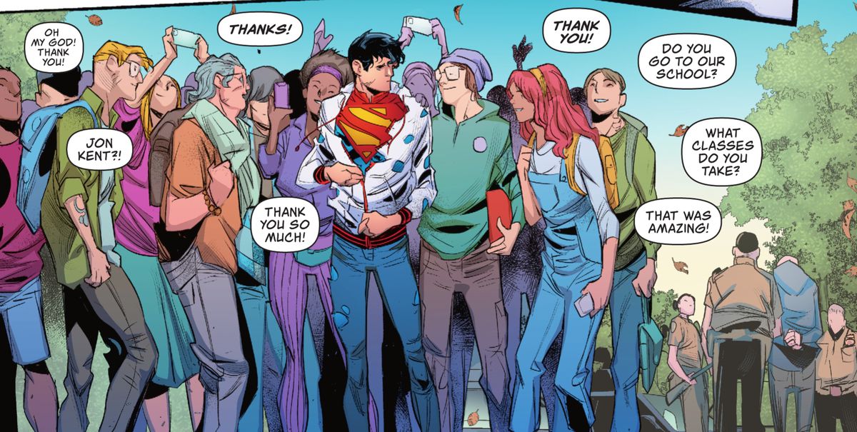 Jon Kent aggiusta la sua giacca a vento piena di proiettili - il suo costume da Superman è chiaramente visibile, mentre gli adolescenti gli sciamano intorno, chiamandolo per nome e ringraziandolo in Superman: Son of Kal-El #2 (2021). 