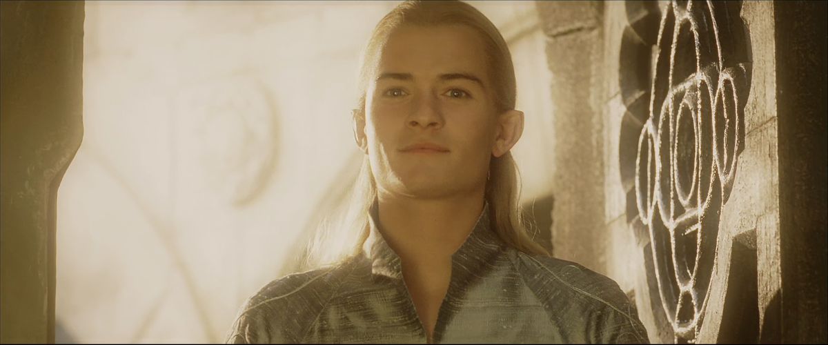 Legolas stands beatifically in a doorway in The Return of the King. 