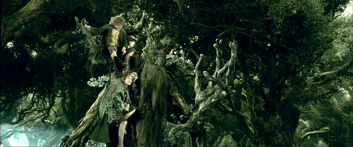 Merry and Pippin ride along on Treebeard’s shoulders in The Two Towers.