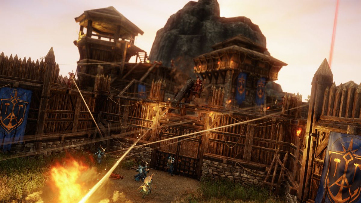 Nuovo mondo: i giocatori attaccano e difendono un forte, usando potenti baliste e magie durante l'assedio