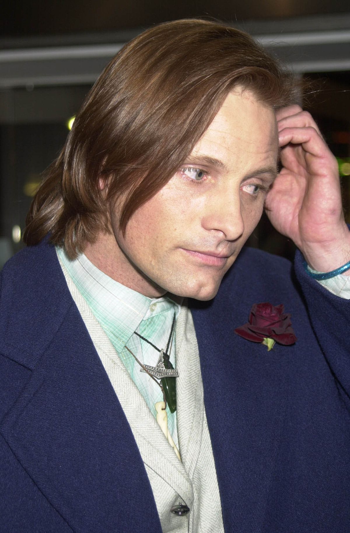 Viggo Mortensen pushes his hair back at the Lord Of The Rings World Movie Premiere