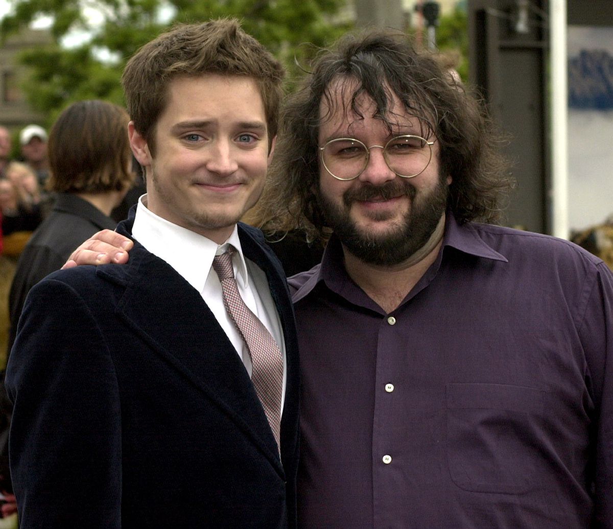 Elijah Wood and Peter Jackson on the red carpet at the Australasian premiere of The Lord of the Rings: The Fellowship of the Ring in Wellington, New Zealand