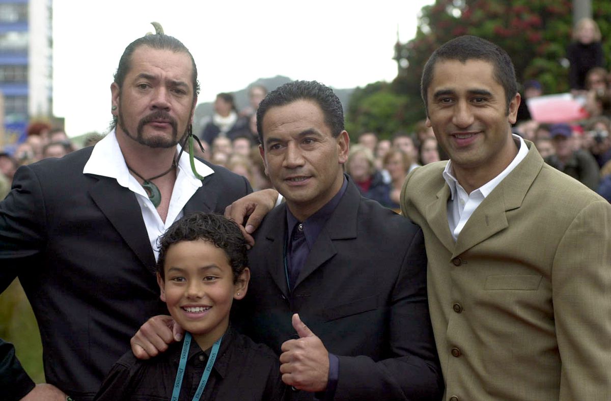 New Zealand actors Cliff Curtis (right), Temuera Morrison (center), and friends on the red carpet at the Australasian premiere of The Lord of the Rings: The Fellowship of the Ring in Wellington, New Zealand