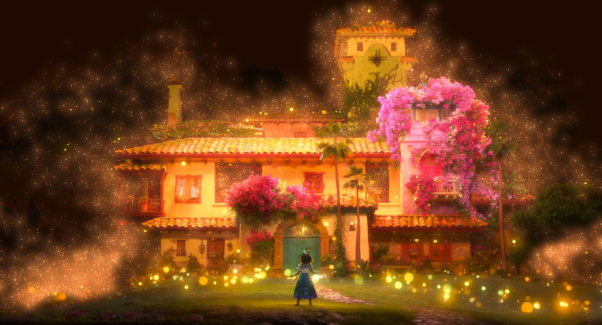 the magical madrigal house with mirabel standing in front of it