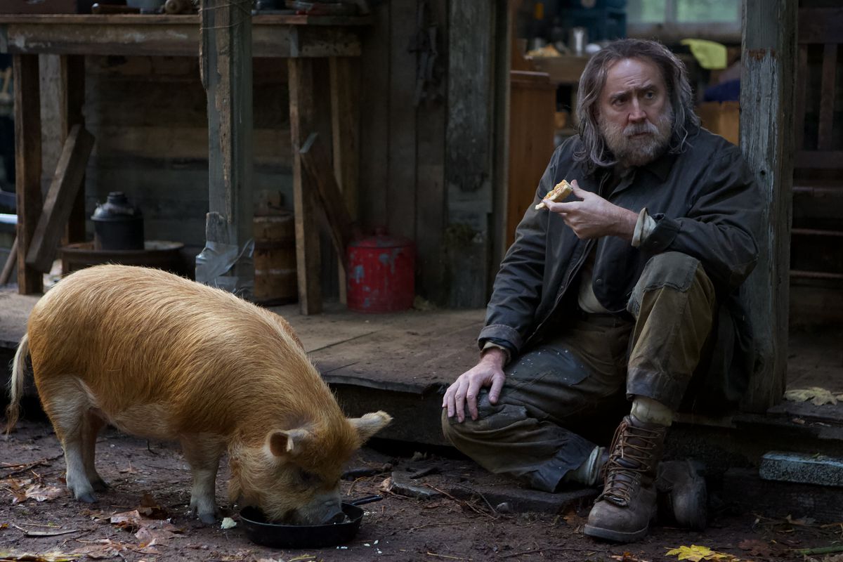 Nicolas Cage, lookin’ scruffy, and a pig, lookin’ fine, in Pig