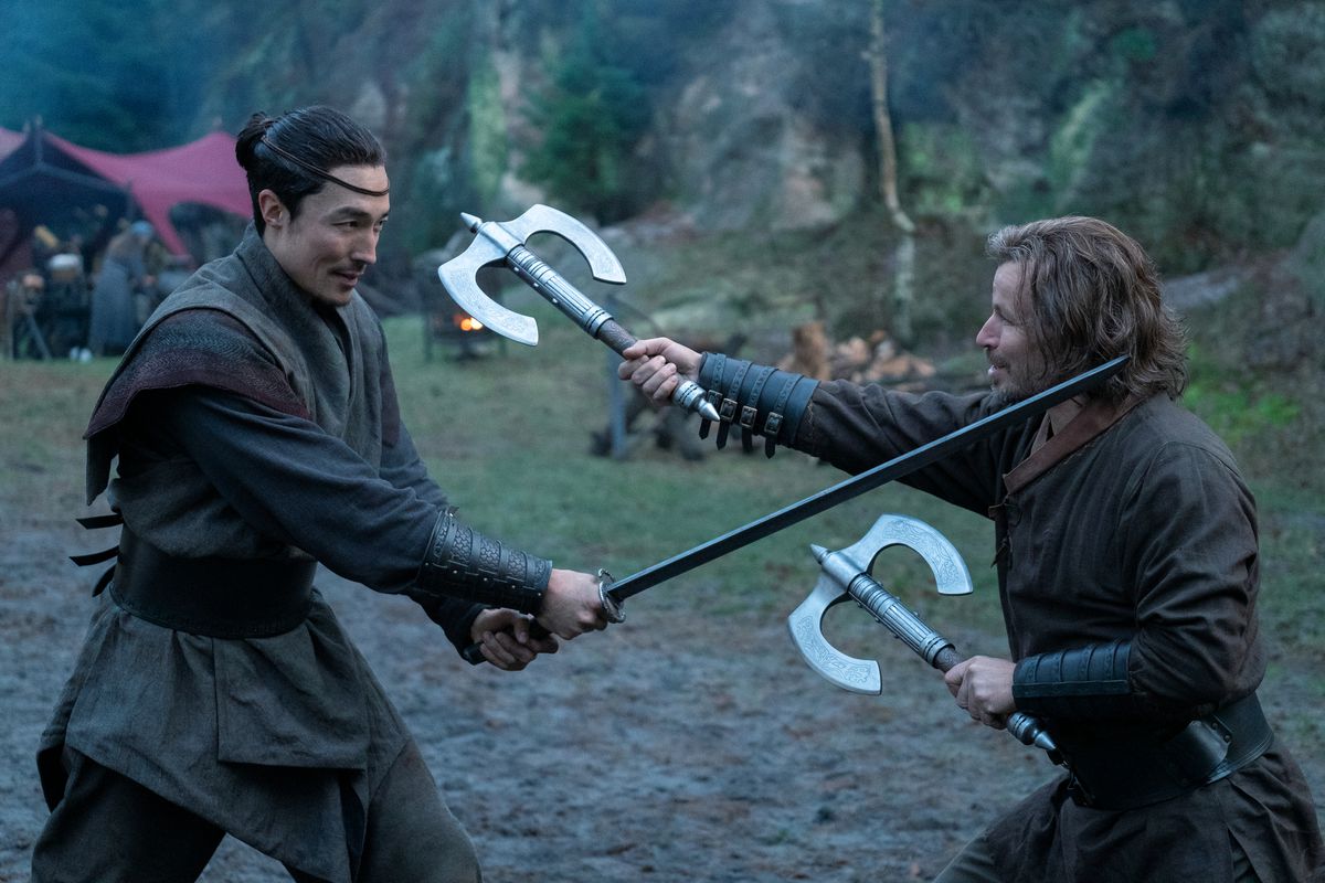 Lan and Stepin play-fighting in a still from Wheel of Time