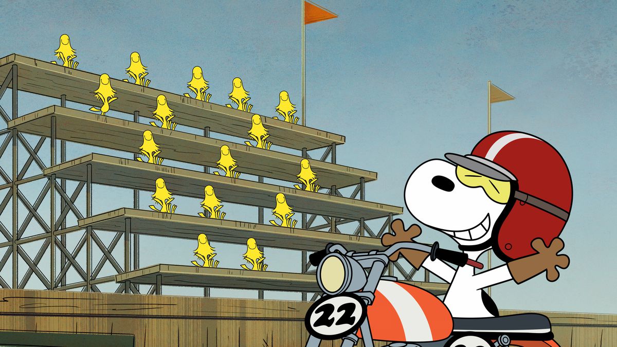 Snoopy celebrates in front of a bleacher full of Woodstocks in a still from The Snoopy Show
