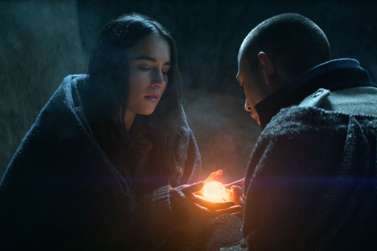A person showing another person magic in a still from Shadow and Bone