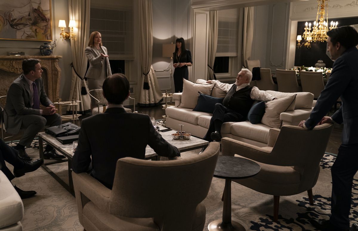 People standing around talking in a still from season 3 of Succession