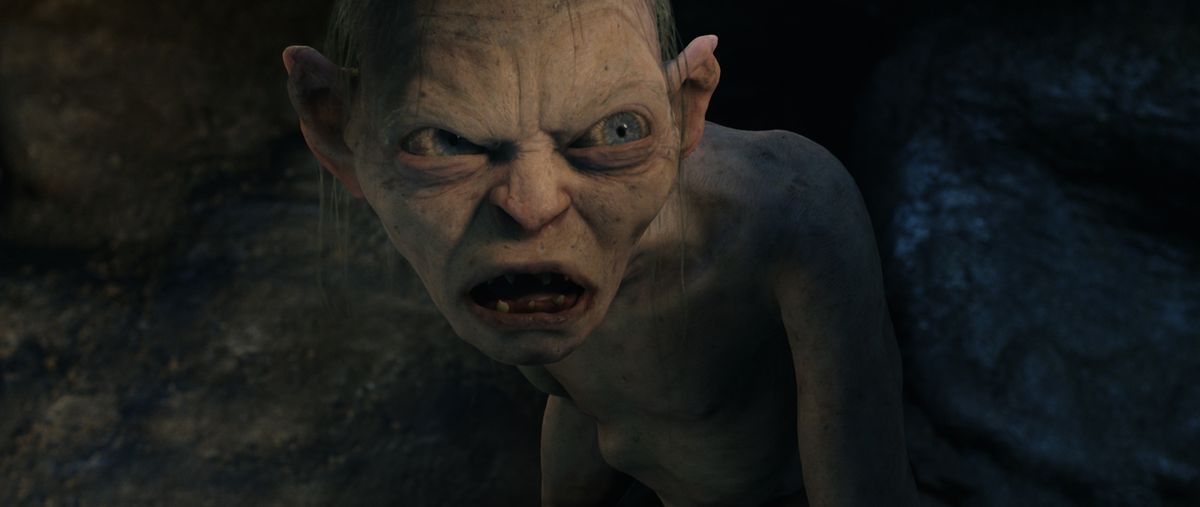 Gollum, half in shadow and half in light, snarls at hobbits in Lord of the Rings: The Two Towers