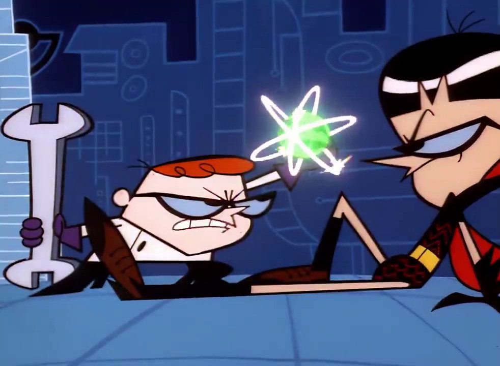 Dexter tiene in mano il protonucleo neurotomico mentre fissa Mandark nel Laboratorio di Dexter: Ego Trip.