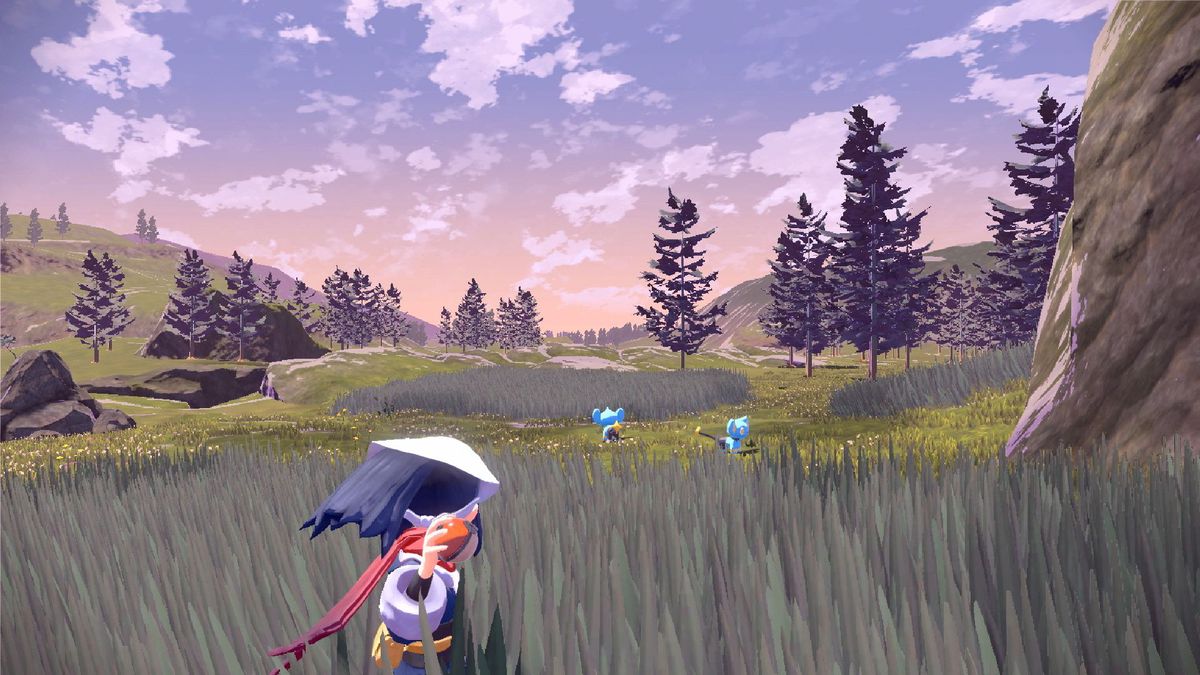 una ragazza in piedi nell'erba alta che lancia una Poké Ball in Pokémon Legends: Arceus