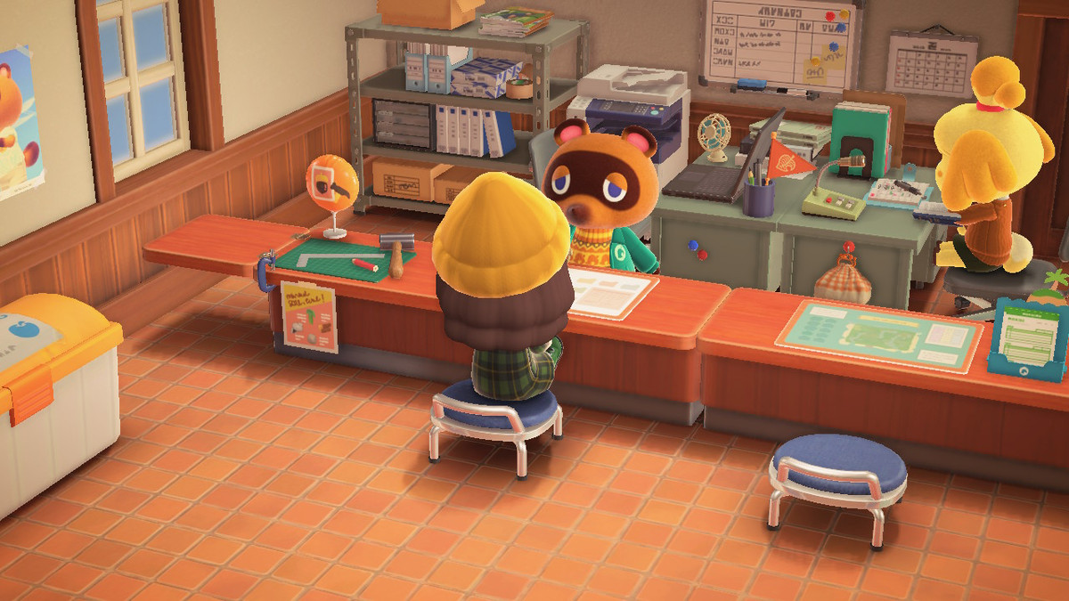 Un abitante del villaggio in Animal Crossing: New Horizons seduto al banco di costruzione di Tom Nook, all'interno dell'edificio Island Services