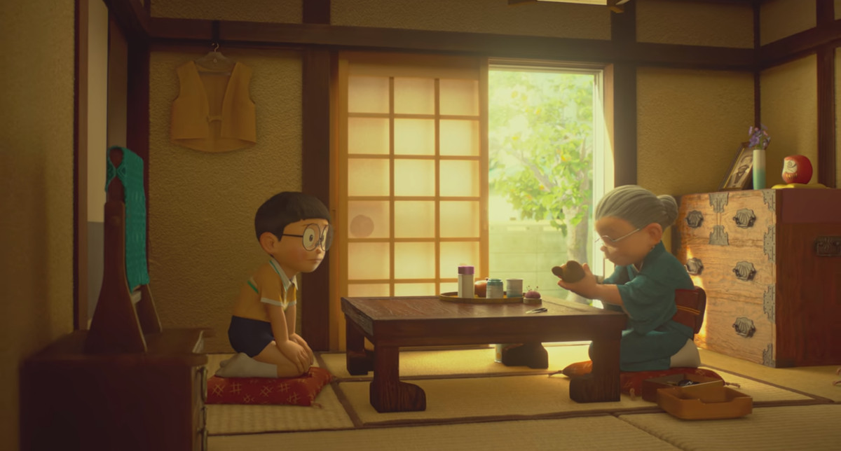 Nobita e sua nonna si inginocchiano a un tavolo in Stand by Me Doraemon 2.