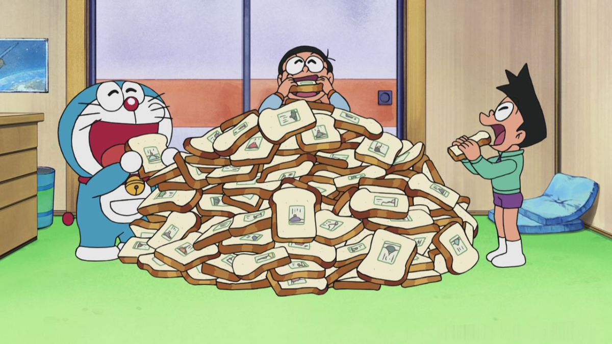 Doraemon e i suoi amici mangiano un'enorme pila di pane dei ricordi, che sembra pane con immagini impresse su di esso.