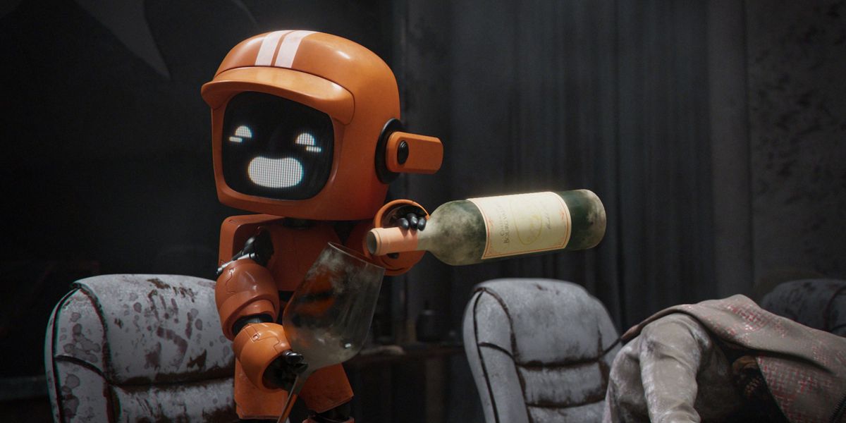 un piccolo robot arancione versa del vino
