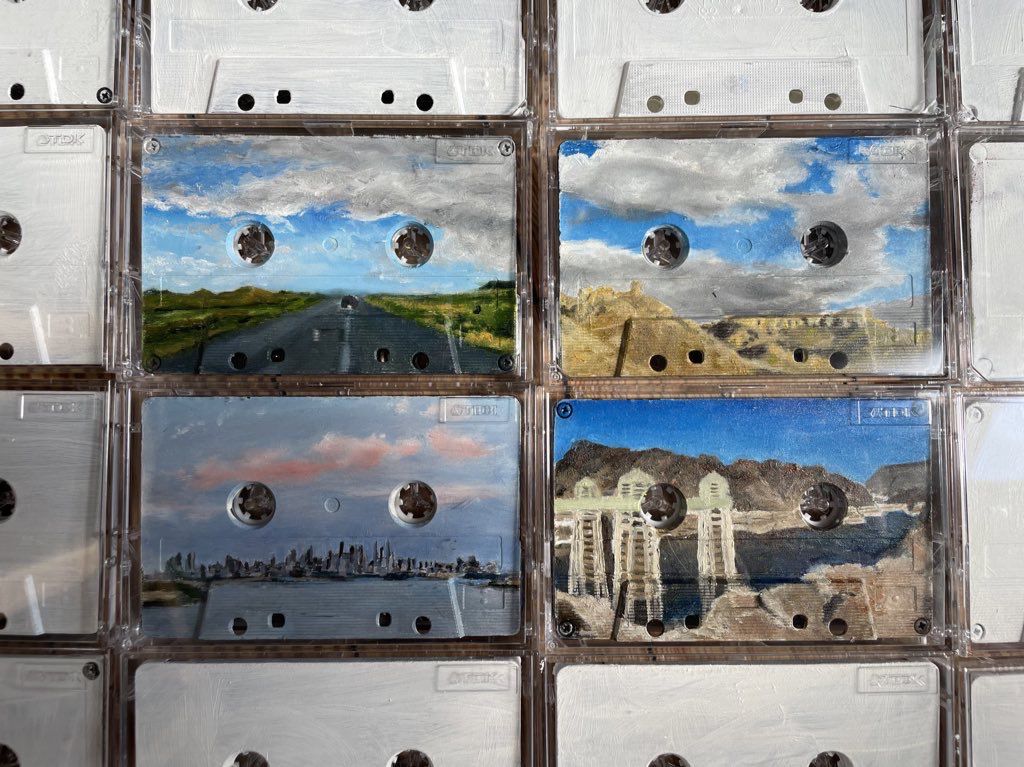 Quattro cassette dipinte raffiguranti Kansas, Colorado, New York e Nevada (in senso orario)