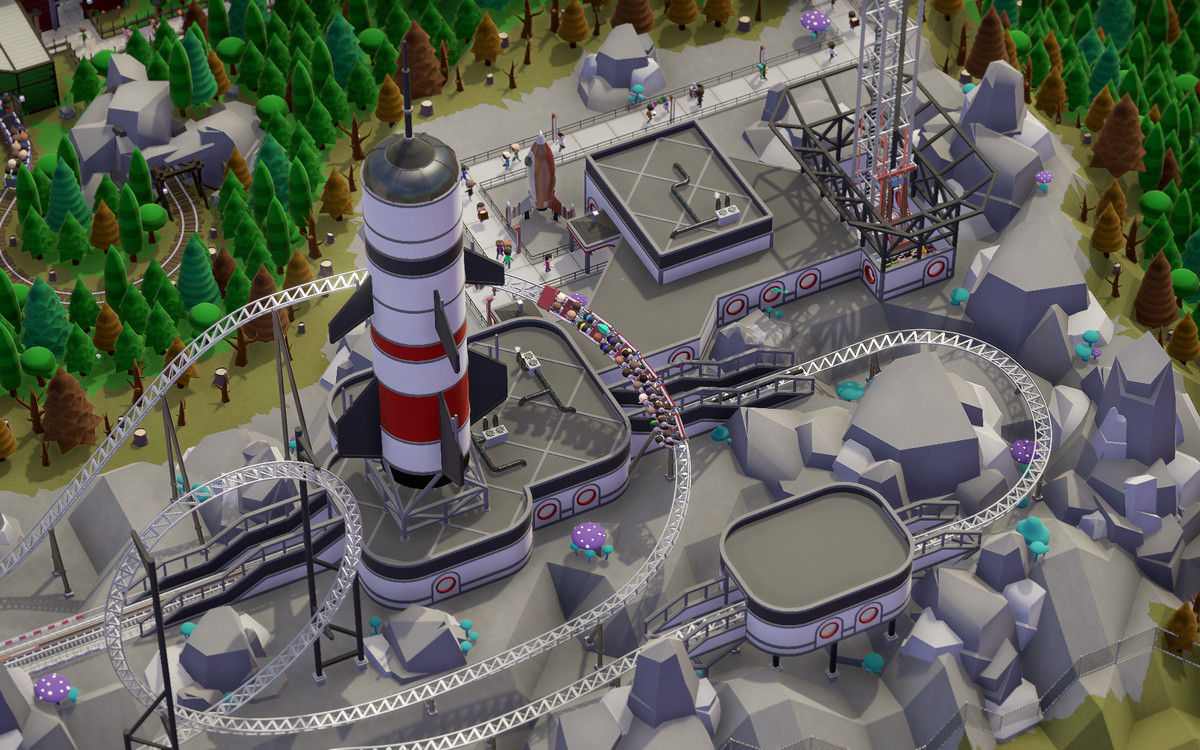 Una vista isometrica di un gioco del parco divertimenti in stile Roller Coaster Tycoon 2.  Lo screenshot si concentra su un ottovolante a tema spaziale.