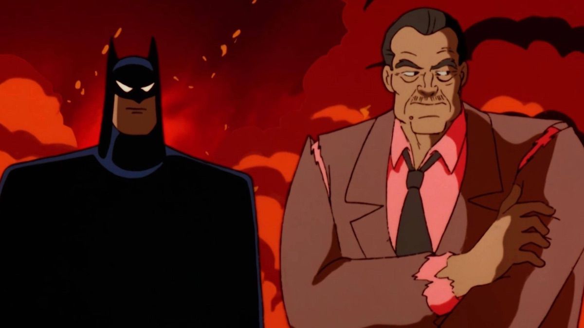Rupert Thorne (R) in piedi accanto a Batman (L) con una giacca strappata davanti a un pennacchio di fumo infuocato in 