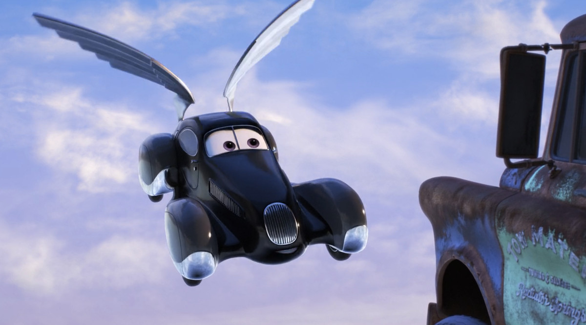 un'auto nera simile a un carro funebre con le ali che fluttuano nel cielo 