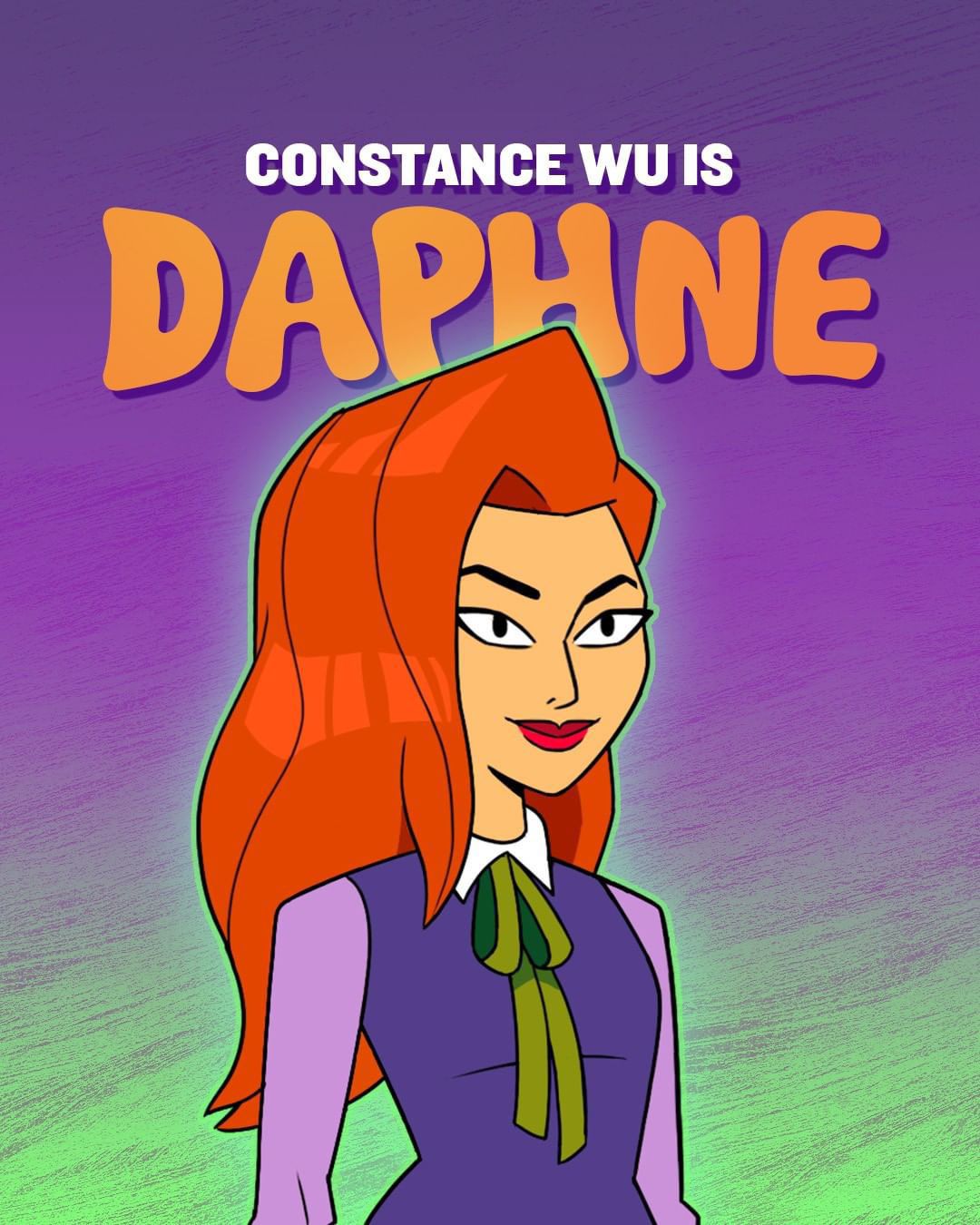 Un post di Daphne con un vestito viola e un papillon verde con la scritta “Constance Wu is Daphne” sopra di lei
