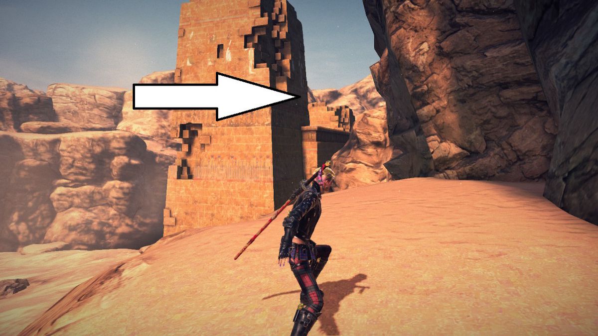 Viola si trova davanti a una torre in mezzo a un deserto a Bayonetta 3.