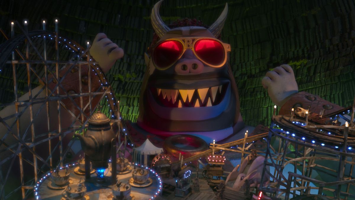 Buffalo Belzer, un gigantesco demone viola che indossa occhiali da sole riflettenti rossi, sorride all'infernale parco divertimenti costruito sulla sua pancia nel film d'animazione in stop-motion Wendell & Wild