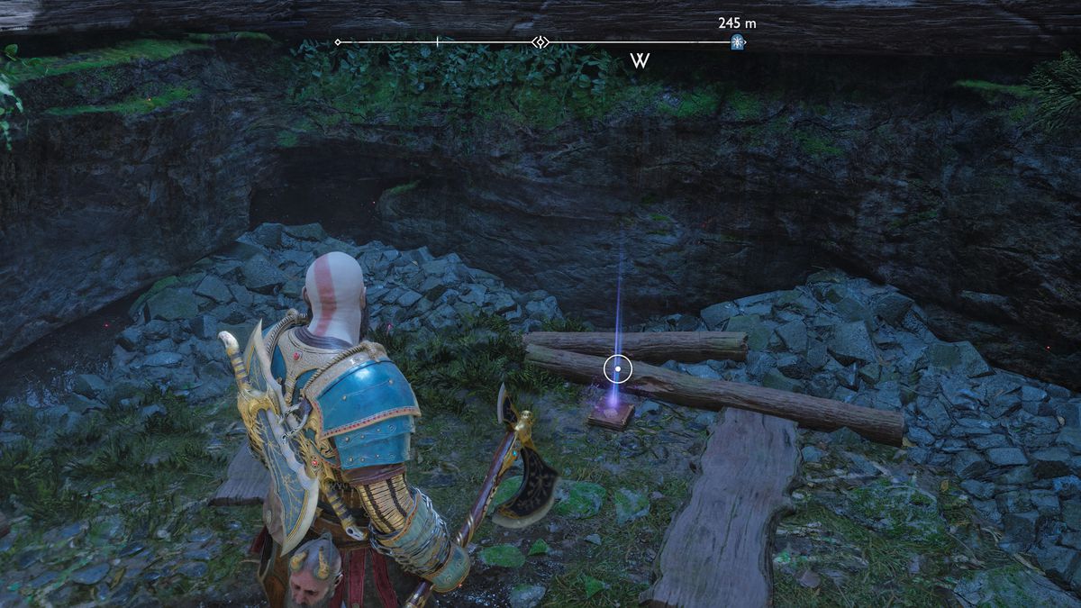 Kratos afferra un artefatto da una fossa in God of War Ragnarok
