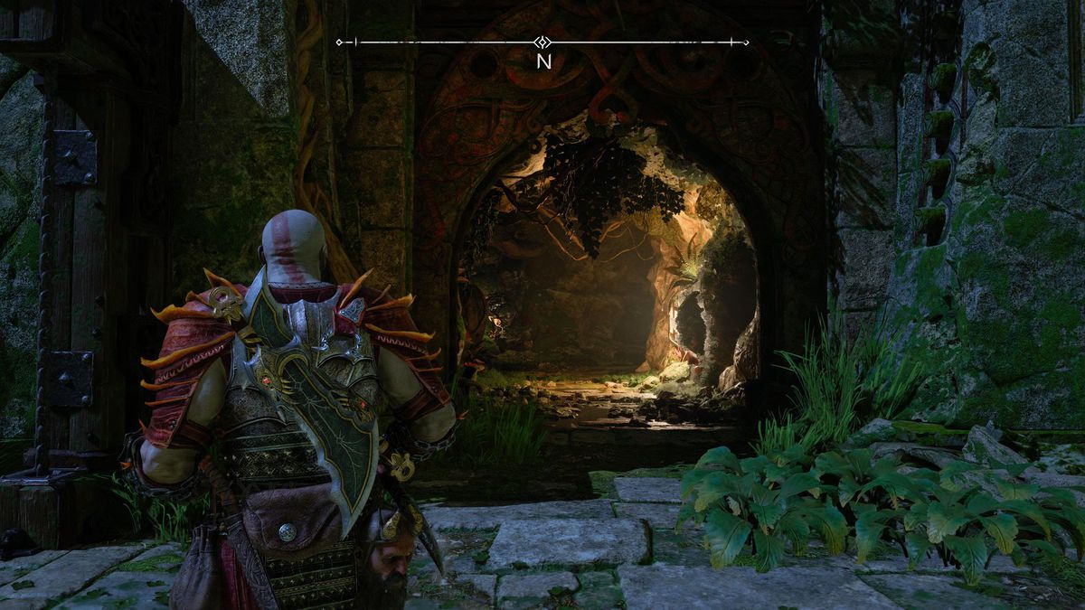 Kratos fissa una grotta in un muro in God of War Ragnarok.