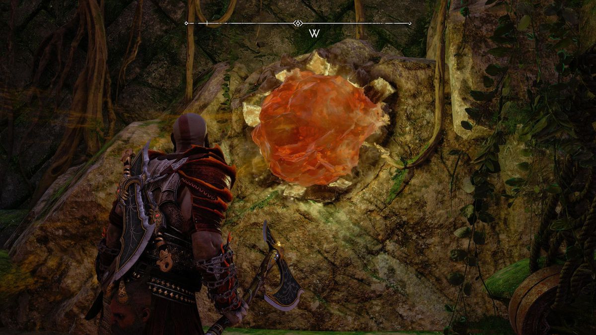 Kratos fissa un frammento cristallino a Vanaheim in God of War Ragnarok.