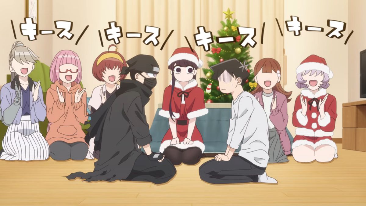 Un gruppo di ragazze anime, alcune delle quali vestite da Babbo Natale, si siedono in fila mentre applaudono e cantano di fronte a due ragazzi anime imbarazzati.