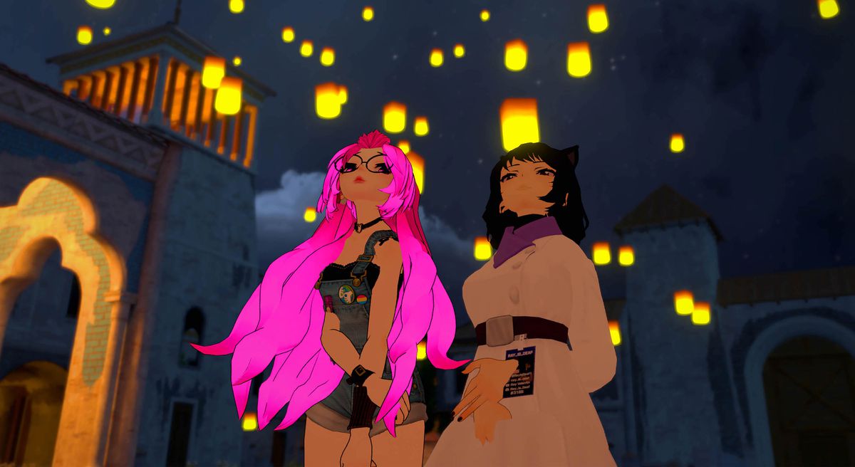 Due avatar in stile anime VRChat, una ragazza con lunghi capelli rosa e una ragazza gatto dai capelli scuri, guardano le lanterne illuminate fluttuare nell'aria in We Met In Virtual Reality
