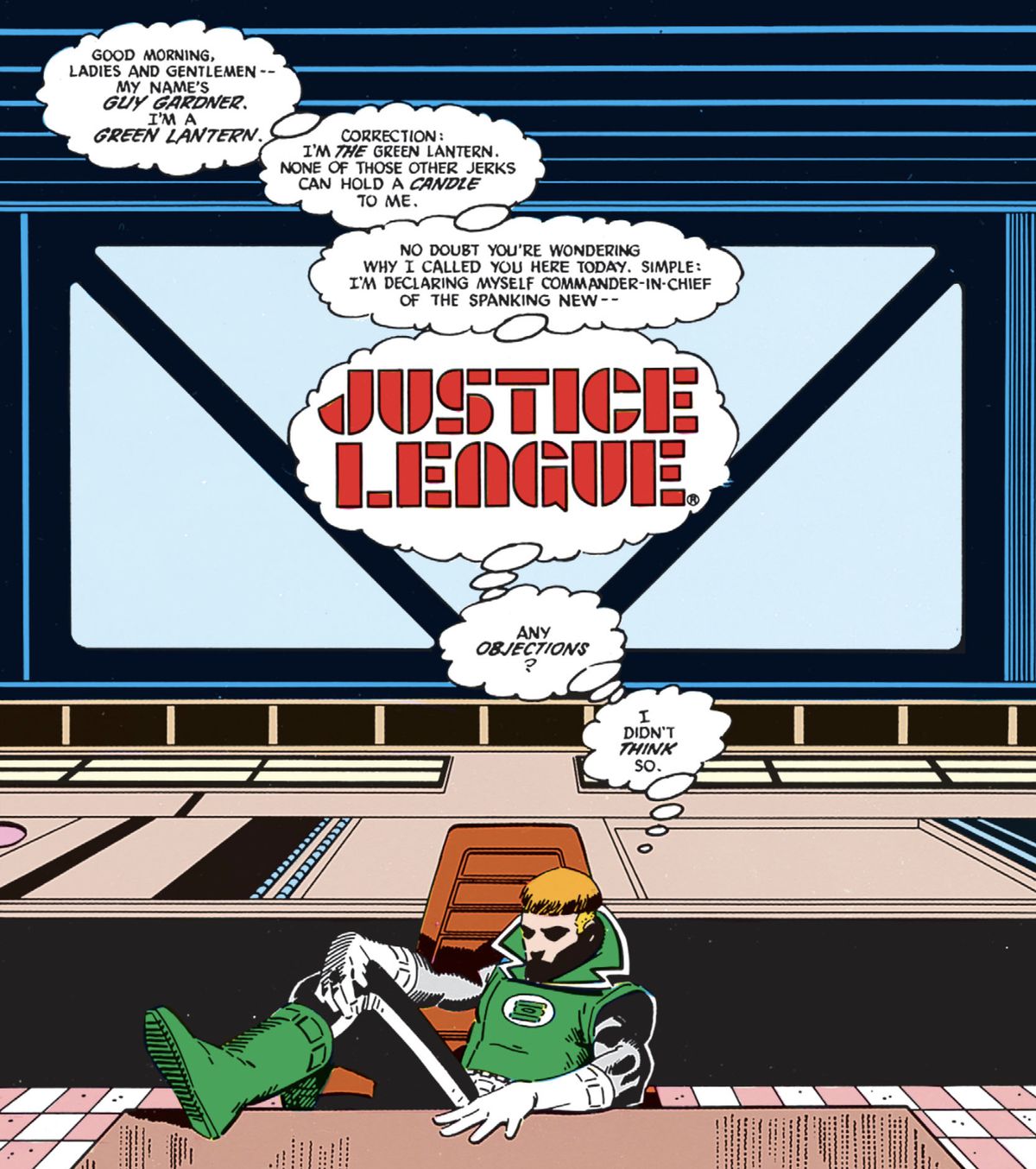 Guy Gardner siede con i piedi alzati sul tavolo della riunione della Justice League, provando mentalmente il discorso sfacciato che lo farà nominare immediatamente caposquadra, in Justice League International #1 (1988).
